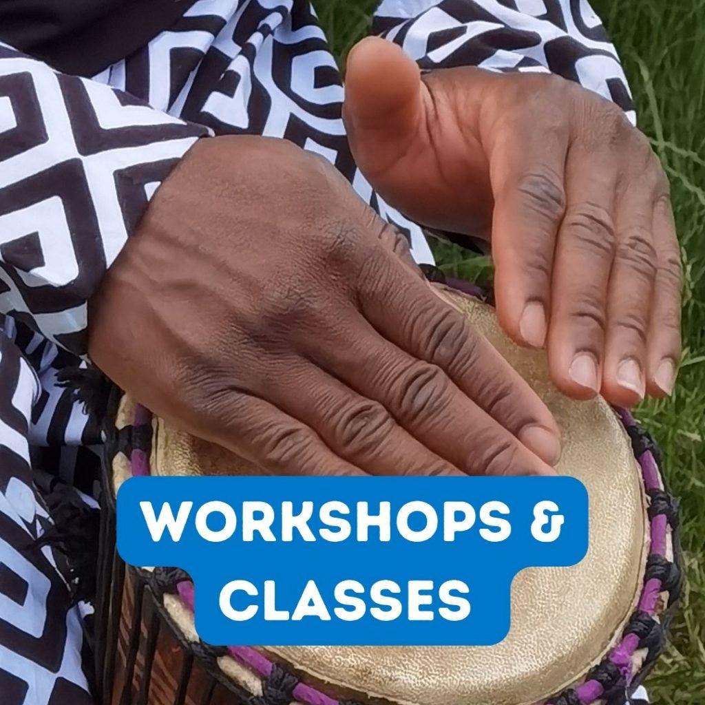 Hands playing an African drum